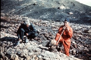 The man on the left is using a PAC 1S to measure alpha radiation. The device, designed for laboratory use, broke easily on the jagged rocks of the search area. 
